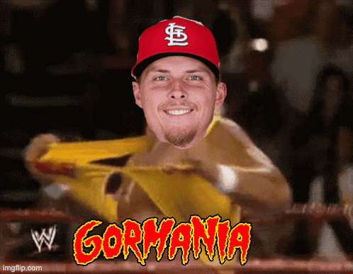 A Man Wearing A Red Cardinals Hat Is In A Wrestling Ring With Gormania Written On The Bottom GIF