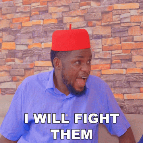 A Man Wearing A Red Hat And A Blue Shirt Says " I Will Fight Them " GIF