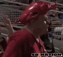 A Man Wearing A Red Hat And A Red Shirt With Woo Pig Written On It GIF