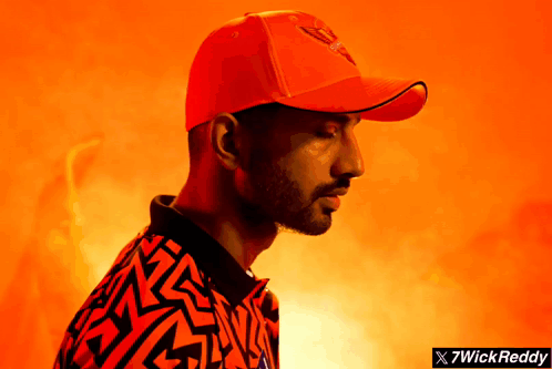 A Man Wearing A Red Hat And A Shirt That Says 7Wickreddy On It GIF
