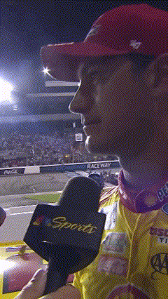 A Man Wearing A Red Hat And A Sports Microphone GIF