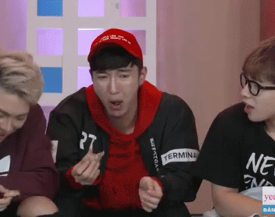 A Man Wearing A Red Hat Has The Number 27 On His Sweatshirt GIF
