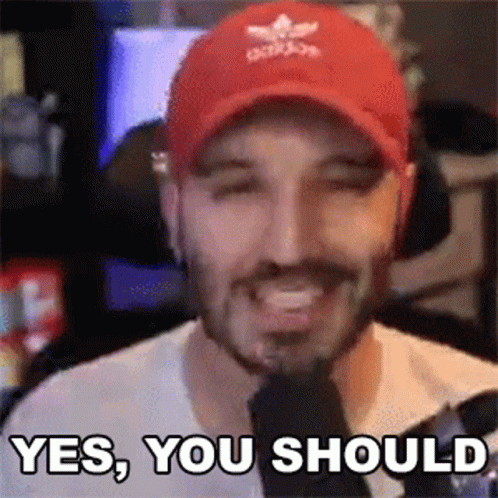 A Man Wearing A Red Hat Is Smiling And Saying Yes You Should . GIF