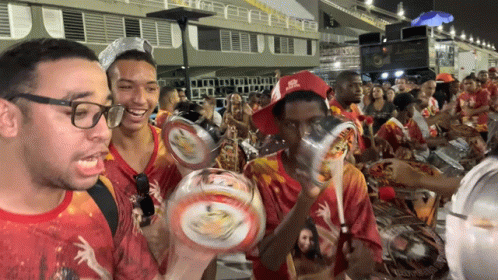 A Man Wearing A Red Hat That Says Rio De Janeiro GIF