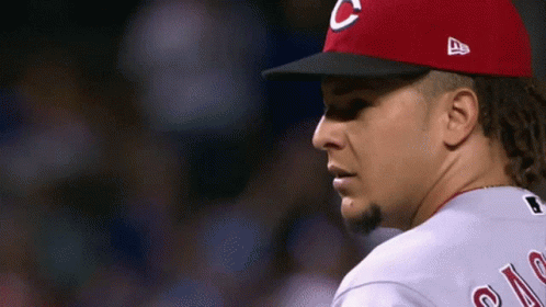 A Man Wearing A Red Hat With A C On It GIF