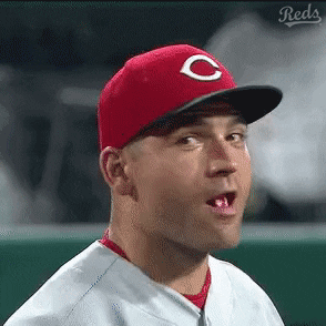 A Man Wearing A Red Hat With A White C On It GIF