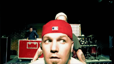A Man Wearing A Red Hat With The Letters Mlb On It GIF