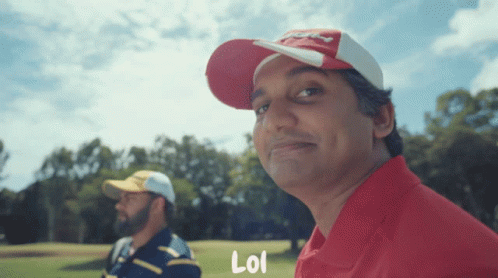 A Man Wearing A Red Hat With The Word Lol On The Bottom GIF