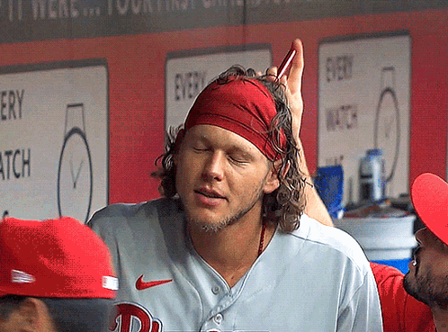 A Man Wearing A Red Headband And A Nike Jersey GIF