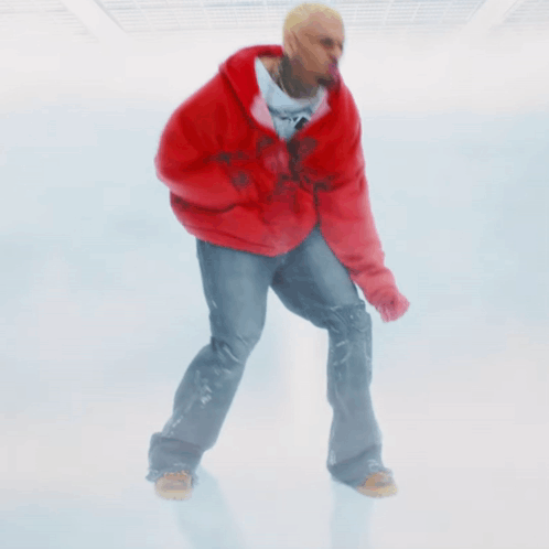 A Man Wearing A Red Hoodie And Jeans Is Standing On A White Background GIF