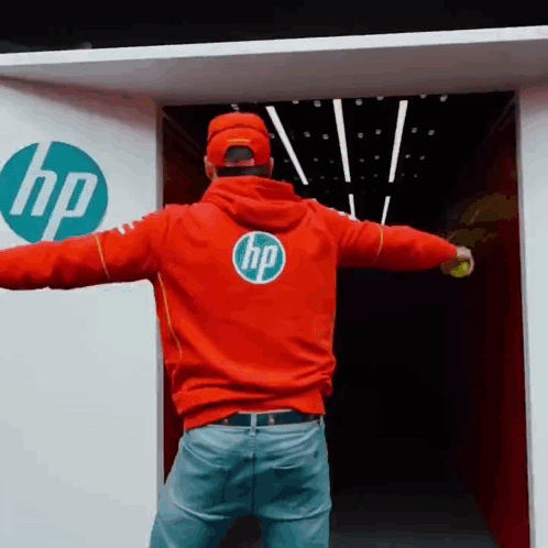 A Man Wearing A Red Hoodie With The Hp Logo On It GIF