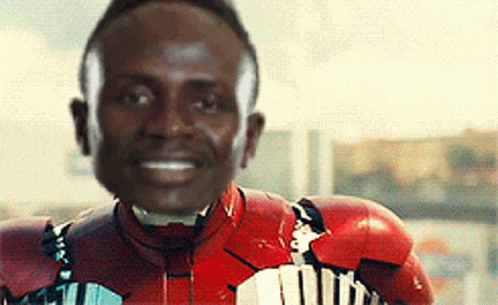 A Man Wearing A Red Iron Man Suit Is Smiling GIF
