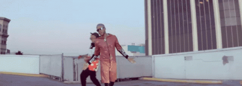 A Man Wearing A Red Jacket With The Word Supreme On The Sleeves GIF