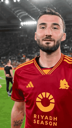 A Man Wearing A Red Jersey That Says Riyadh Season On It GIF