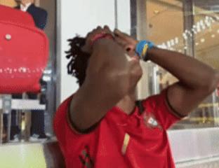 A Man Wearing A Red Jersey With The Number 1 On The Front GIF