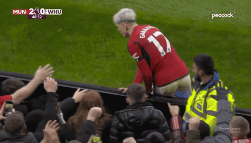 a man wearing a red jersey with the number 17 on the back
