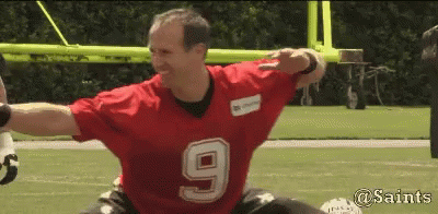 A Man Wearing A Red Jersey With The Number 9 On It Is On A Football Field GIF