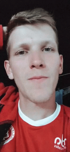 A Man Wearing A Red Shirt That Says 20B6jtn On It GIF