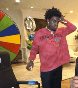 A Man Wearing A Red Shirt That Says Grasshoppers On It GIF