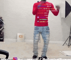 A Man Wearing A Red Shirt That Says Illuminati GIF
