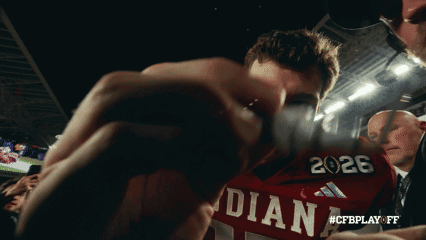 A Man Wearing A Red Shirt That Says Indiana GIF