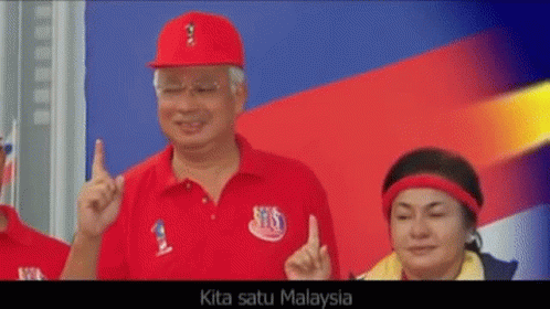 A Man Wearing A Red Shirt That Says Kita Satu Malaysia Is Giving A Thumbs Up GIF