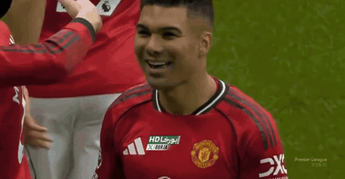 a man wearing a red shirt that says napdrag on it