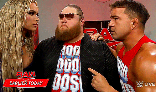 A Man Wearing A Red Shirt That Says No Duo Dos Is Standing Next To Two Other Men GIF