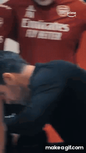 A Man Wearing A Red Shirt That Says ' Prime ' On It GIF