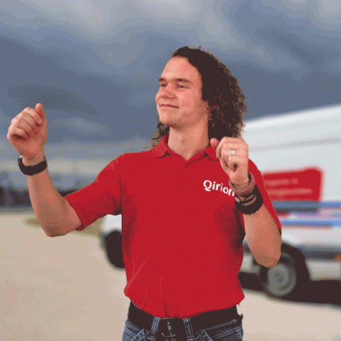 A Man Wearing A Red Shirt That Says ' Qirion ' On It GIF