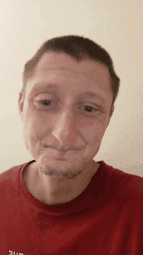 A Man Wearing A Red Shirt That Says Ufc On It Makes A Funny Face GIF