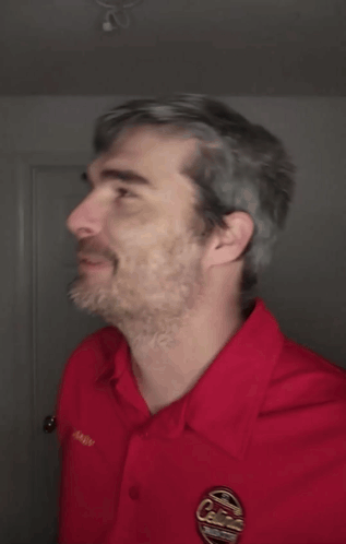 A Man Wearing A Red Shirt With The Word Dammit On The Bottom GIF