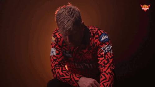 A Man Wearing A Red Shirt With The Word Knock On The Bottom GIF