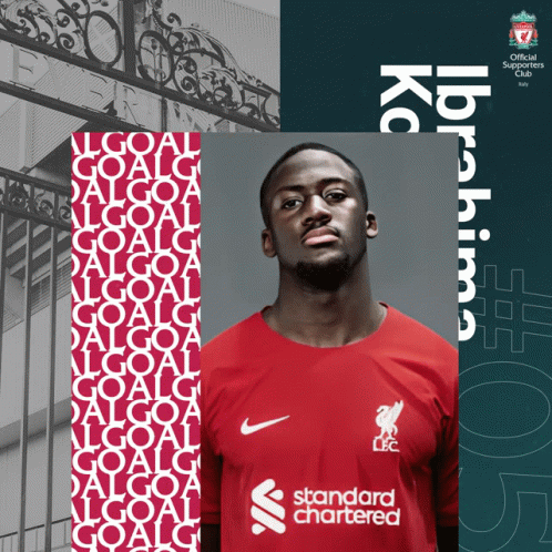 a man wearing a red shirt with the word standard chartered on it