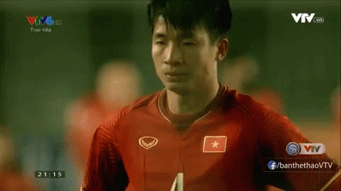 A Man Wearing A Red Soccer Jersey With A Star On The Front GIF
