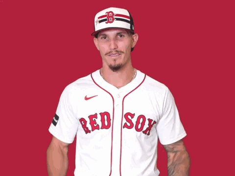 A Man Wearing A Red Sox Jersey With His Hands Up GIF