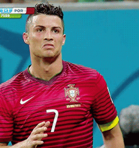 A Man Wearing A Red Striped Shirt With The Number 7 On It GIF