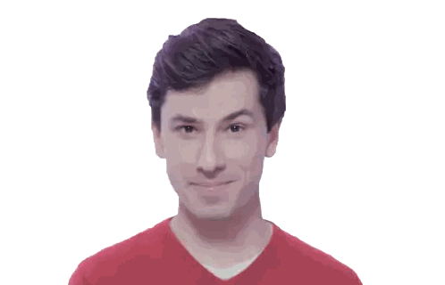 a man wearing a red sweater is smiling and looking at the camera