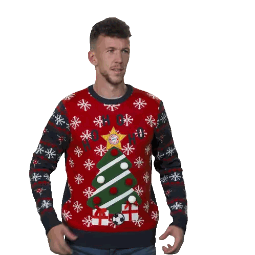 a man wearing a red sweater with a christmas tree on it throws a red box