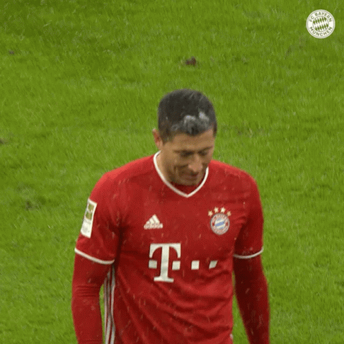 A Man Wearing A Red T-Mobile Jersey Stands On A Soccer Field GIF
