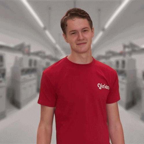 A Man Wearing A Red T-Shirt That Says ' Qirion ' On The Front GIF