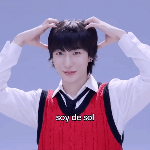 Man In Red Vest And Tie With Soy De Sol On Chest GIF