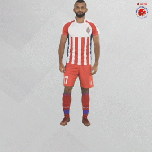 a man wearing a red white and blue striped jersey with the number 17 on his shorts