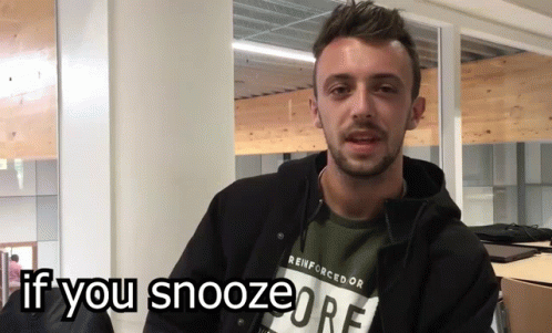 A Man Wearing A Reinforcedor T-Shirt Is Asking If You Snooze GIF