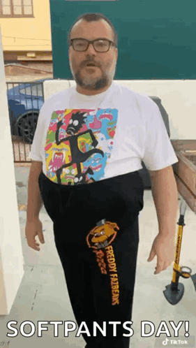 A Man Wearing A Rick And Morty Shirt And Sweatpants Is Standing In Front Of A Building . GIF