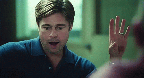 A Man Wearing A Ring On His Finger Is Looking At His Hand GIF