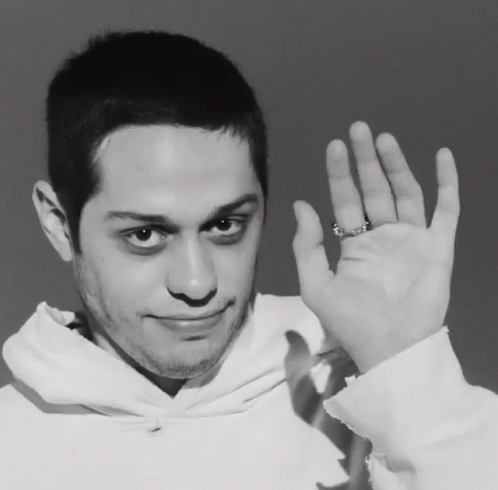 A Man Wearing A Ring On His Finger Is Waving His Hand GIF