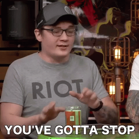 A Man Wearing A Riot Shirt Says You 'Ve Gotta Stop In Front Of A Can Of Soda GIF