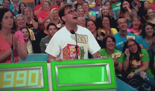 A Man Wearing A Ryan Shirt Stands In Front Of A Crowd GIF