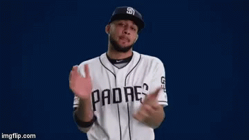 A Man Wearing A San Diego Padres Baseball Uniform Is Clapping His Hands GIF